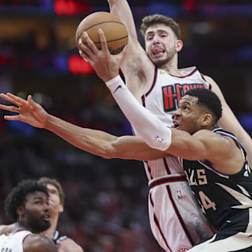 Feb 25, 2025; Houston, Texas, USA; Milwaukee Bucks forward Giannis Antetokounmpo (34) attempts to drive with the ball around Houston Rockets center Alperen Sengun (28) during the fourth quarter at Toyota Center. Mandatory Credit: Troy Taormina-Imagn Images