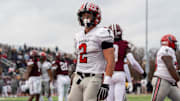 Marcello Vitti (2) of Divine Child stands on the end zone after scoring a rushing touchdown against Harper Woods during the Division 4 regional final at John Glenn High School in Westland on Saturday, Nov. 15, 2025.