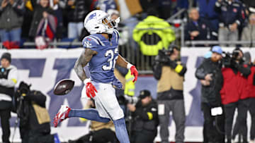 Nov 13, 2025; Foxborough, Massachusetts, USA; New England Patriots running back TreVeyon Henderson (32) scores a touchdown during the first half against the New York Jets at Gillette Stadium. Mandatory Credit: Eric Canha-Imagn Images