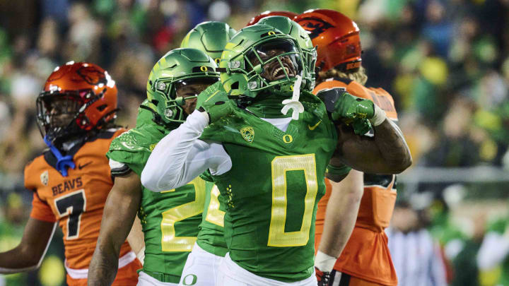 Nov 24, 2023; Eugene, Oregon, USA; Oregon Ducks defensive back Tysheem Johnson (0) celebrates after making a tackle on a kickoff return during the second half against the Oregon State Beavers at Autzen Stadium.