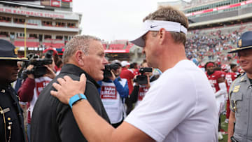 Nov 2, 2024; Fayetteville, Arkansas, USA; Arkansas Razorbacks head coach Sam Pittman shakes hands with Ole Miss Rebels head coach Lane Kiffin after the game at Donald W. Reynolds Razorback Stadium. Mississippi won 63-31. Mandatory Credit: Nelson Chenault-Imagn Images