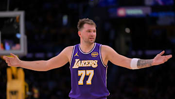Nov 28, 2025; Los Angeles, California, USA;  Los Angeles Lakers guard Luka Doncic (77) reacts after a foul on Dallas Mavericks forward Naji Marshall (13) in the second half at Crypto.com Arena. Mandatory Credit: Jayne Kamin-Oncea-Imagn Images