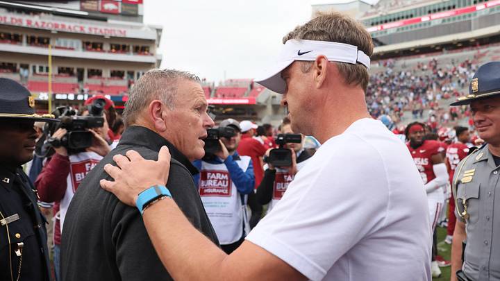 Nov 2, 2024; Fayetteville, Arkansas, USA; Arkansas Razorbacks head coach Sam Pittman shakes hands with Ole Miss Rebels head coach Lane Kiffin after the game at Donald W. Reynolds Razorback Stadium. Mississippi won 63-31. Mandatory Credit: Nelson Chenault-Imagn Images