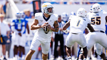 Aug 30, 2025; Lexington, Kentucky, USA; Toledo Rockets quarterback Tucker Gleason (4) lines up a pass during the second quarter against the Kentucky Wildcat at Kroger Field. Mandatory Credit: Jordan Prather-Imagn Images