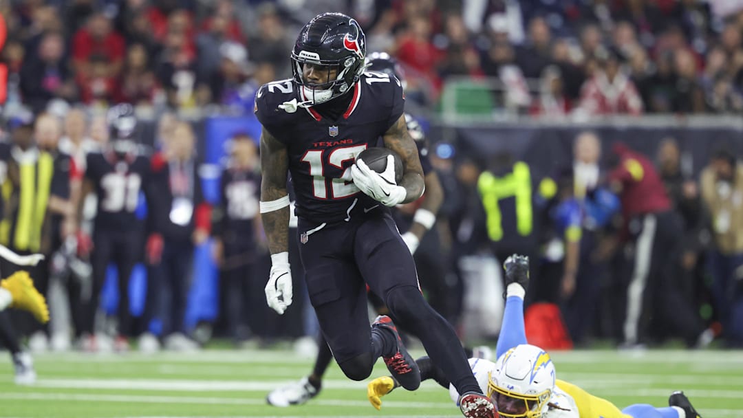 Jan 11, 2025; Houston, Texas, USA; Houston Texans wide receiver Nico Collins (12) runs with the ball after a reception during the game against the Los Angeles Chargers in an AFC wild card game at NRG Stadium. Mandatory Credit: Troy Taormina-Imagn Images Jan 11, 2025; Houston, Texas, USA; Houston Texans wide receiver Nico Collins (12) runs with the ball after a reception during the game against the Los Angeles Chargers in an AFC wild card game at NRG Stadium. Mandatory Credit: Troy Taormina-Imagn Images