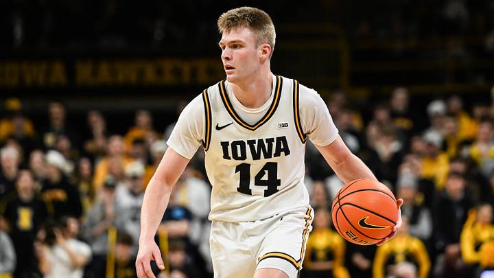 Jan 28, 2026; Iowa City, Iowa, USA; Iowa Hawkeyes guard Bennett Stirtz (14) controls the ball against the Southern California Trojans during the second half at Carver-Hawkeye Arena. Mandatory Credit: Jeffrey Becker-Imagn Images