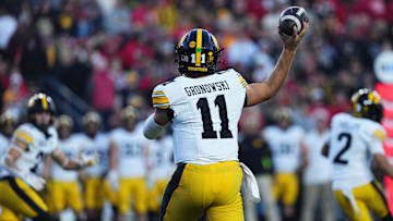 Oct 11, 2025; Madison, Wisconsin, USA; Iowa Hawkeyes quarterback Mark Gronowski (11) attempts a pass in the first quarter against the Wisconsin Badgers at Camp Randall Stadium. Mandatory Credit: Ross Harried-Imagn Images