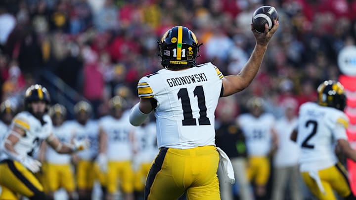 Oct 11, 2025; Madison, Wisconsin, USA; Iowa Hawkeyes quarterback Mark Gronowski (11) attempts a pass in the first quarter against the Wisconsin Badgers at Camp Randall Stadium. Mandatory Credit: Ross Harried-Imagn Images