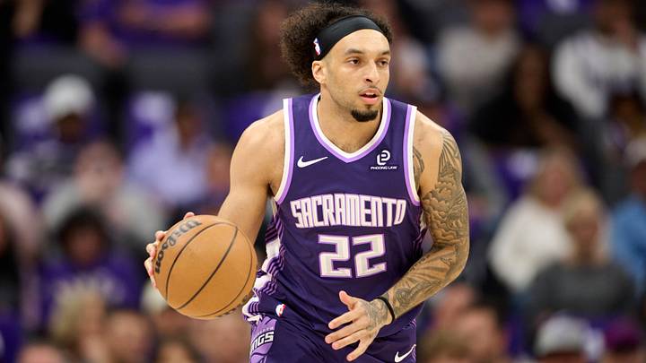 Apr 10, 2026; Sacramento, California, USA; Sacramento Kings guard Devin Carter (22) brings the ball upcourt against the Golden State Warriors during the first quarter at Golden 1 Center. Mandatory Credit: Robert Edwards-Imagn Images