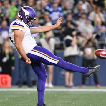 Aug 10, 2023; Seattle, Washington, USA; Minnesota Vikings punter Ryan Wright (14) punts the ball against the Seattle Seahawks at Lumen Field. 