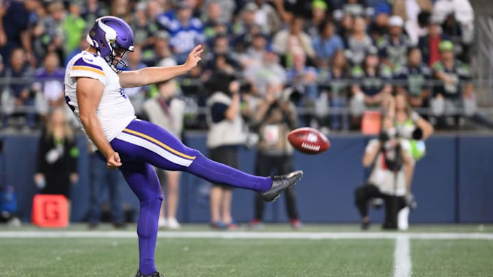 Aug 10, 2023; Seattle, Washington, USA; Minnesota Vikings punter Ryan Wright (14) punts the ball against the Seattle Seahawks at Lumen Field. 