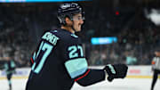 Oct 9, 2025; Seattle, Washington, USA; Seattle Kraken left wing Mason Marchment (27) celebrates after scorig a goal against the Anaheim Ducks during the second period at Climate Pledge Arena. Mandatory Credit: Steven Bisig-Imagn Images