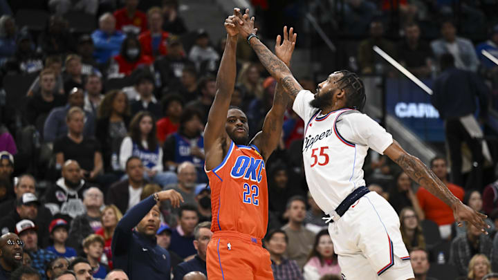 Nov 2, 2024; Inglewood, California, USA; Oklahoma City Thunder guard Cason Wallace (22) shoots against LA Clippers forward Derrick Jones Jr. (55) during the second half at Intuit Dome. Mandatory Credit: Jonathan Hui-Imagn Images