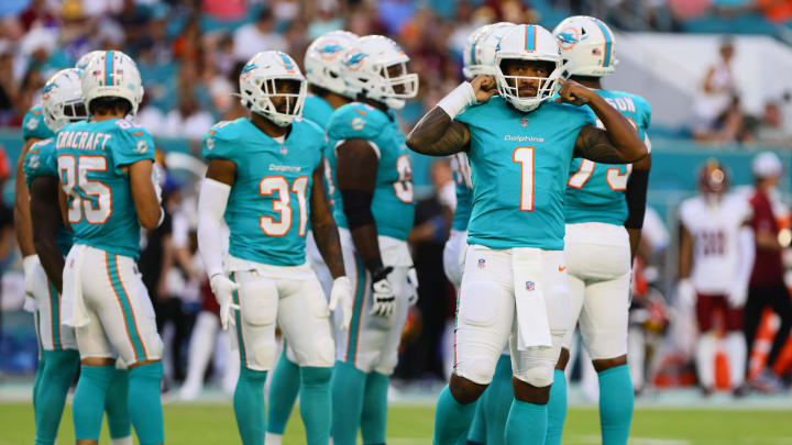 Aug 17, 2024; Miami Gardens, Florida, USA; Miami Dolphins quarterback Tua Tagovailoa (1) looks on from the field against the Washington Commanders during the first quarter of a preseason game at Hard Rock Stadium. Mandatory Credit: Sam Navarro-USA TODAY Sports