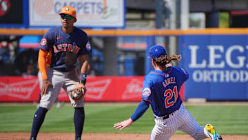 Feb 25, 2024; Port St. Lucie, Florida, USA;  New York Mets outfielder Ben Gamel (21) steals second base in the second inning as Houston Astros shortstop Dixon Machado (26) looks on at Clover Park. Mandatory Credit: Jim Rassol-USA TODAY Sports