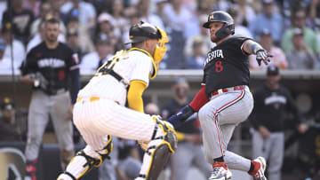 Aug 21, 2024; San Diego, California, USA; Minnesota Twins catcher Christian Vazquez (8) scores a run past San Diego Padres catcher Kyle Higashioka (20) during the fourth inning at Petco Park. Mandatory Credit: Orlando Ramirez-USA TODAY Sports