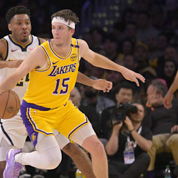 Mar 19, 2025; Los Angeles, California, USA: Denver Nuggets guard Jalen Pickett (24) defends Los Angeles Lakers guard Austin Reaves (15) in the second half at Crypto.com Arena. Mandatory Credit: Jayne Kamin-Oncea-Imagn Images