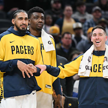 Mar 22, 2025; Indianapolis, Indiana, USA; Indiana Pacers forward James Johnson (16), forward Obi Toppin (1) and guard T.J. McConnell (9) watch from the bench during the second half against the Brooklyn Nets at Gainbridge Fieldhouse. Mandatory Credit: Robert Goddin-Imagn Images
