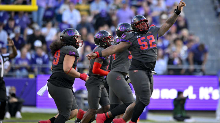 Nov 18, 2023; Fort Worth, Texas, USA; TCU Horned Frogs defensive lineman Damonic Williams (52) and the Frogs defense celebrate after making a defensive stop against the Baylor Bears during the second half at Amon G. Carter Stadium. Mandatory Credit: Jerome Miron-USA TODAY Sports