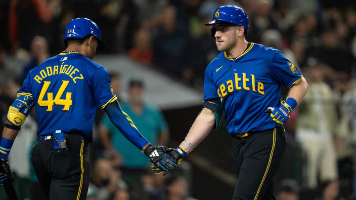 Seattle Mariners first baseman Luke Raley (right) is congratulated after a solo home run against the San Francisco Giants on Friday at T-Mobile Park.