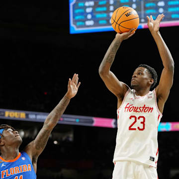 Apr 7, 2025; San Antonio, TX, USA; Houston Cougars guard Terrance Arceneaux (23) shoots the ball against Florida Gators guard Denzel Aberdeen (11) during the first half of the national championship game of the Final Four of the 2025 NCAA Tournament at the Alamodome.
