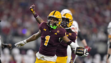 Dec 7, 2024; Arlington, TX, USA; Arizona State Sun Devils defensive back Keith Abney II (1) and defensive back Shamari Simmons (7) celebrate during the game between the Iowa State Cyclones and the Arizona State Sun Devils at AT&T Stadium. Mandatory Credit: Jerome Miron-Imagn Images