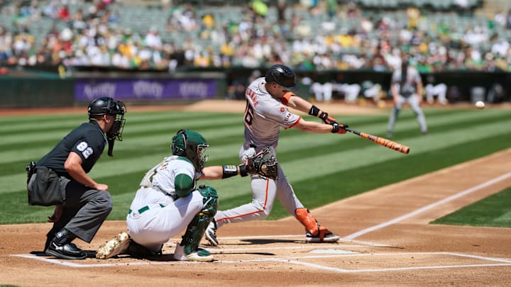 Aug 18, 2024; Oakland, California, USA; San Francisco Giants infielder Mark Canha (16) bats against the Oakland Athletics during the first inning at Oakland-Alameda County Coliseum.