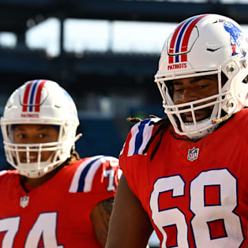 Dec 1, 2024; Foxborough, Massachusetts, USA; New England Patriots center Lecitus Smith (68) warms up before a game against the Indianapolis Colts at Gillette Stadium. Mandatory Credit: Eric Canha-Imagn Images