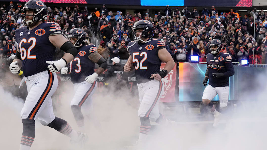 Jan 4, 2026; Chicago, Illinois, USA; Chicago Bears guard Joe Thuney (62) and center Drew Dalman (52) run onto the field before the game between the Chicago Bears and the Detroit Lions at Soldier Field. Mandatory Credit: David Banks-Imagn Images