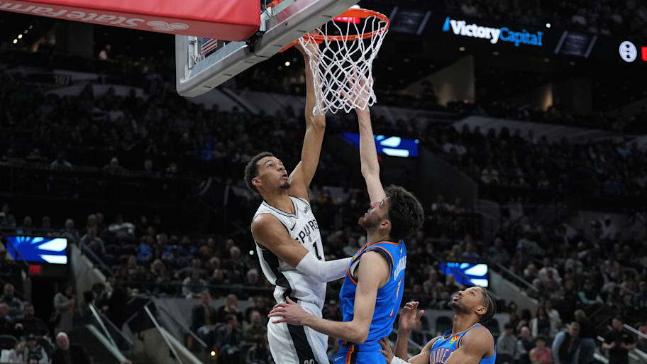 San Antonio Spurs center Victor Wembanyama shoots over Oklahoma City Thunder forward Chet Holmgren.