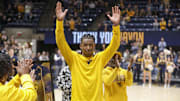 Mar 8, 2025; Morgantown, West Virginia, USA; West Virginia Mountaineers guard Javon Small (7) waives to the crowd during Senior Day ceremonies before their game against the UCF Knights at WVU Coliseum. Mandatory Credit: Ben Queen-Imagn Images