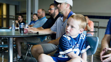 Marty McCord, wearing a Jared Lorenzen jersey, watches Matt Jones perform a special radio show in honor of Jared Lorenzen in front of a live audience at Highlands Athletics in Fort Thomas, Ky., on Thursday, July 11, 2019.  Kentucky Sports Radio host Matt Jones and started a fund to help support Jared Lorenzen's family.

Kentucky Sports Radio Jared Lorenzen