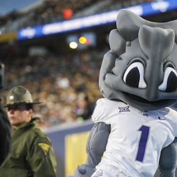 Oct 25, 2025; Morgantown, West Virginia, USA; The Texas Christian University Horned Frogs mascot celebrates along the sidelines during the first quarter against the West Virginia Mountaineers at Milan Puskar Stadium. Mandatory Credit: Ben Queen-Imagn Images
