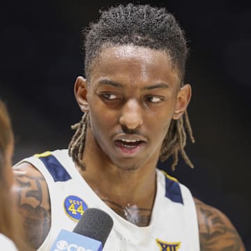 Feb 25, 2025; Morgantown, West Virginia, USA; West Virginia Mountaineers guard Javon Small (7) answers questions during a postgame interview after defeating the TCU Horned Frogs at WVU Coliseum. Mandatory Credit: Ben Queen-Imagn Images