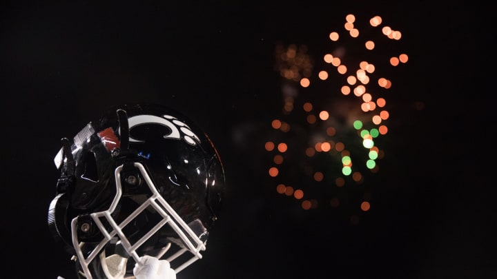 Cincinnati Bearcats player lifts his helmet after the Birmingham Bowl between Cincinnati Bearcats and Boston College Eagles on Thursday, Jan. 2, 2020, at Legion Field in Birmingham, Ala. Cincinnati Bearcats wont 38-6.

Birmingham Bowl