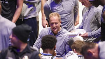 Feb 11, 2025; Morgantown, West Virginia, USA; Brigham Young Cougars head coach Kevin Young talks to his team during a timeout during the second half against the West Virginia Mountaineers at WVU Coliseum. Mandatory Credit: Ben Queen-Imagn Images