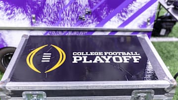 Jan 1, 2024; New Orleans, LA, USA; A general view of the College Football Playoff logo on a case on the Washington Huskies sideline before the 2024 Sugar Bowl college football playoff semifinal game between the Texas Longhorns and the Washington Huskies at Caesars Superdome. Mandatory Credit: Stephen Lew-USA TODAY Sports