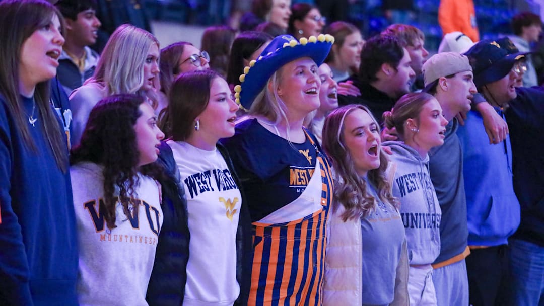 Nov 17, 2025; Morgantown, West Virginia, USA; West Virginia Mountaineers students sing “Country Roads” after defeating the Lafayette Leopards at WVU Coliseum. Mandatory Credit: Ben Queen-Imagn Images