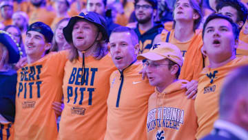 Nov 13, 2025; Morgantown, West Virginia, USA; West Virginia Mountaineers head coach Ross Hodge sings “Country Roads” with students after defeating the Pittsburgh Panthers at WVU Coliseum. Mandatory Credit: Ben Queen-Imagn Images