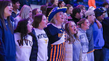 Nov 17, 2025; Morgantown, West Virginia, USA; West Virginia Mountaineers students sing “Country Roads” after defeating the Lafayette Leopards at WVU Coliseum. Mandatory Credit: Ben Queen-Imagn Images