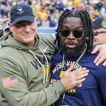 Nov 8, 2025; Morgantown, West Virginia, USA; West Virginia Mountaineers head coach Rich Rodriguez celebrates after defeating the Colorado Buffaloes at Milan Puskar Stadium. Mandatory Credit: Ben Queen-Imagn Images