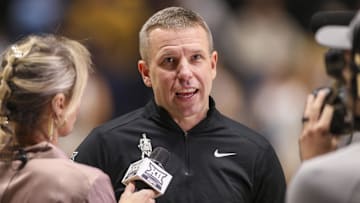 Nov 30, 2025; Morgantown, West Virginia, USA; West Virginia Mountaineers head coach Ross Hodge is interviewed at halftime against the Mercyhurst Lakers at Hope Coliseum. Mandatory Credit: Ben Queen-Imagn Images