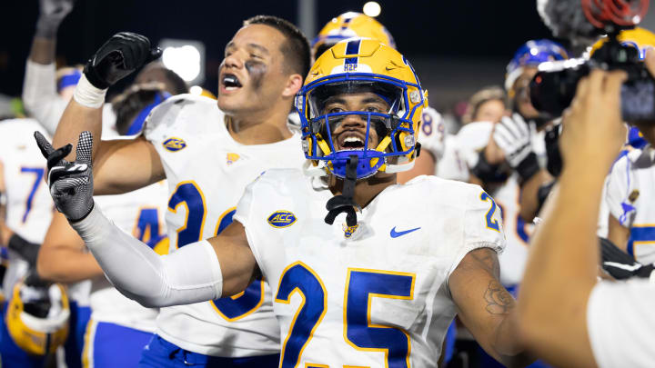 Sep 17, 2022; Kalamazoo, Michigan, USA;  Pittsburgh Panthers cornerback A.J. Woods (35) and Brandon George (30) celebrate beating the Western Michigan Broncos after the game at Waldo Stadium. Mandatory Credit: Kimberly Moss-USA TODAY Sports