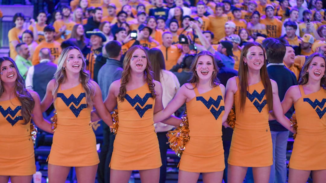 Nov 13, 2025; Morgantown, West Virginia, USA; The West Virginia Mountaineers dance team sings “Country Roads” after defeating the Pittsburgh Panthers at WVU Coliseum. Mandatory Credit: Ben Queen-Imagn Images
