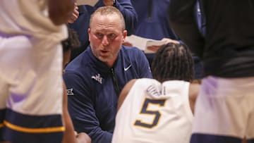  Virginia Mountaineers head coach Darian DeVries talks to his team during the second half against the Brigham Young Cougars at WVU Coliseum.