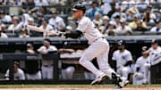 Jun 21, 2025; Bronx, New York, USA; New York Yankees outfielder Cody Bellinger (35) hits a single against the Baltimore Orioles during the first inning at Yankee Stadium. Mandatory Credit: John Jones-Imagn Images
