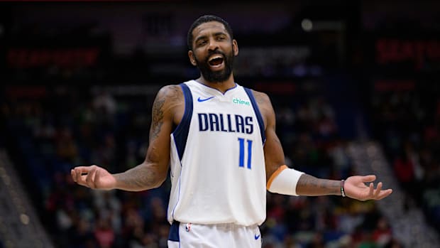 Jan 29, 2025; New Orleans, Louisiana, USA; Mavericks guard Kyrie Irving interacts with fan.