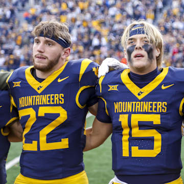 Nov 8, 2025; Morgantown, West Virginia, USA; West Virginia Mountaineers quarterback Scotty Fox Jr. (15) sings “Country Roads” after defeating the Colorado Buffaloes at Milan Puskar Stadium. Mandatory Credit: Ben Queen-Imagn Images