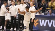 Feb 25, 2025; Morgantown, West Virginia, USA; West Virginia Mountaineers guard Joseph Yesufu (1) celebrates during the second half against the TCU Horned Frogs at WVU Coliseum. Mandatory Credit: Ben Queen-Imagn Images