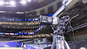 A general view of an ESPN television camera with the College Football Playoff logo before the 2024 Sugar Bowl college football playoff semifinal game between the Texas Longhorns and the Washington Huskies.